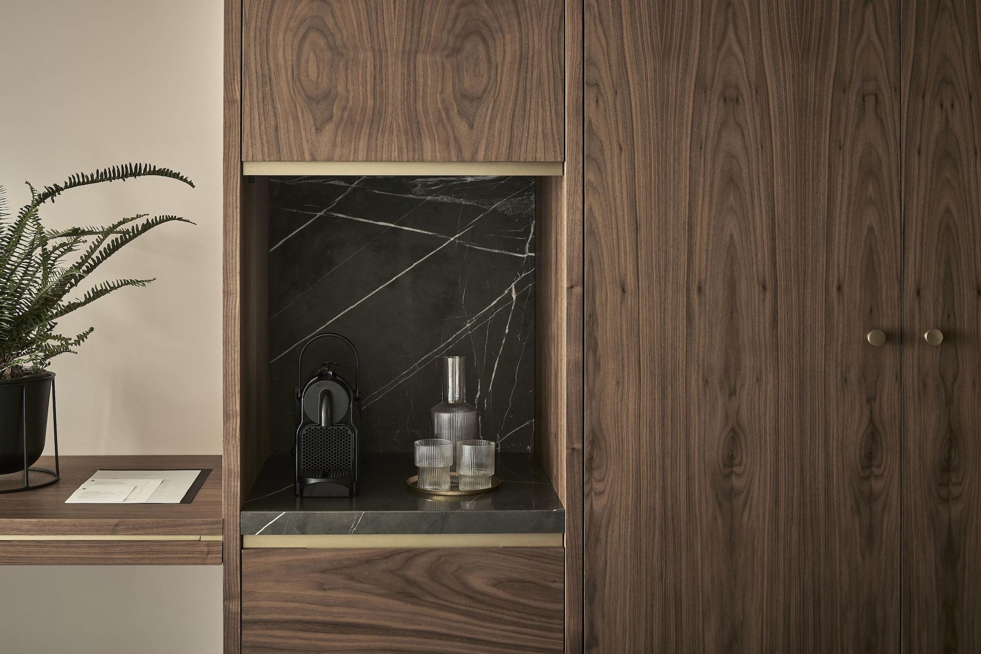 Perianth Hotel Athena Bagian luar foto A coffee machine in a kitchen