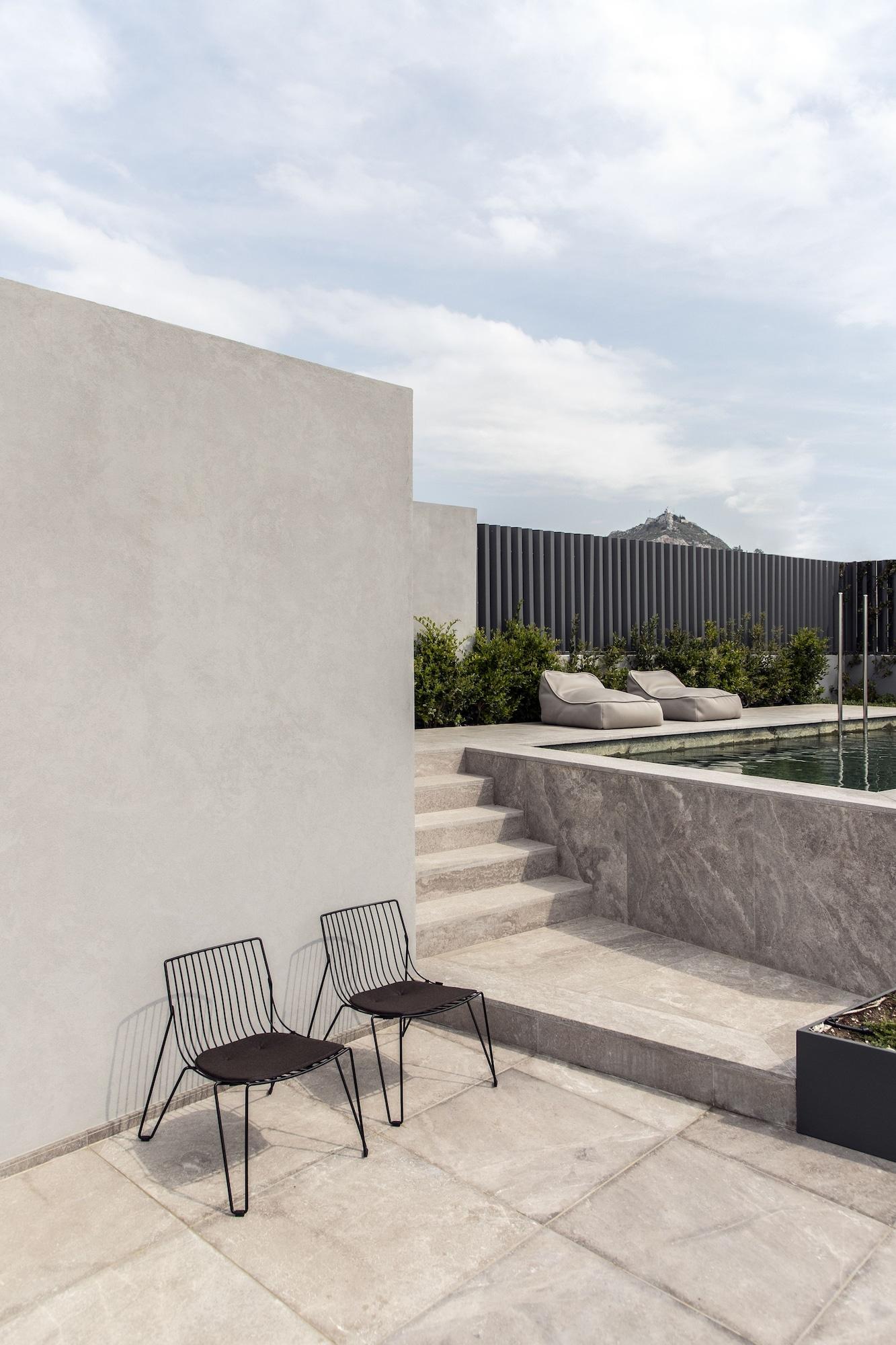 Perianth Hotel Athena Bagian luar foto Exterior wall and pool tiles