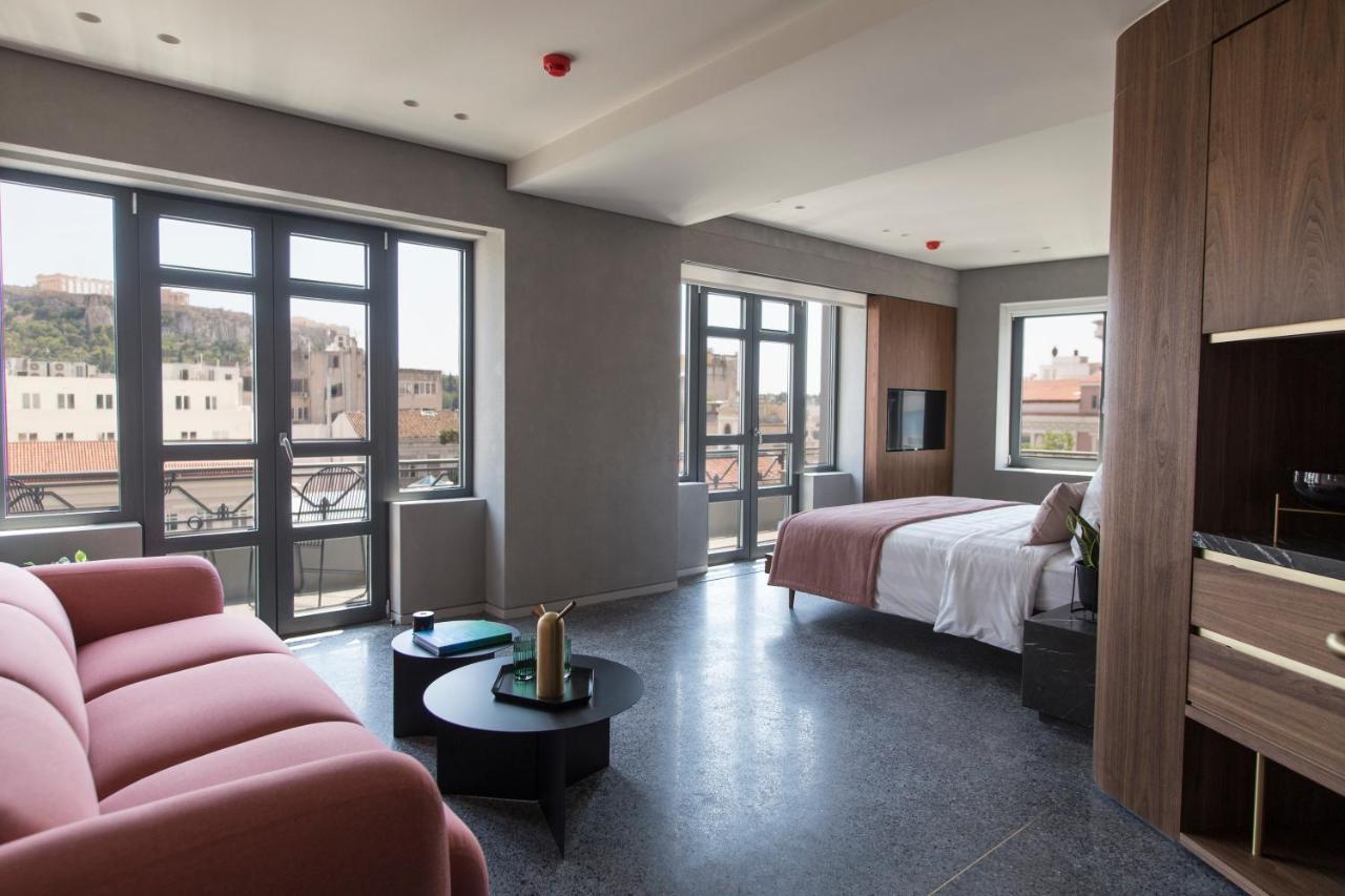 Perianth Hotel Athena Bagian luar foto A room at the hotel